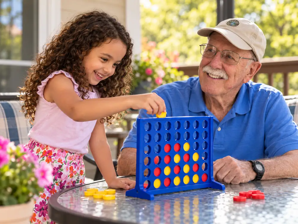 Older adult and child playing Connect Four
